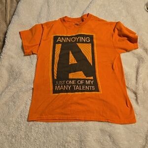 033126 Annoying The World One Person At A Time Humor T Shirt Orange kids Sz XL (